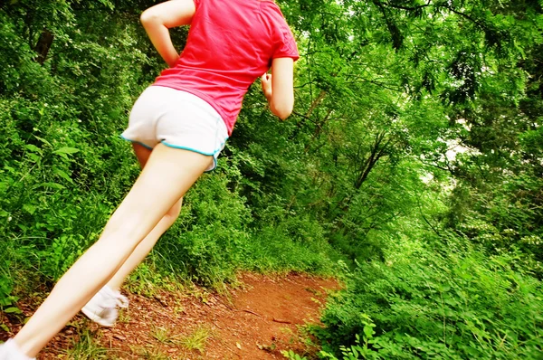 Жінка в червоних біг — стокове фото