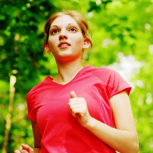 Mujer en rojo corriendo —  Fotos de Stock