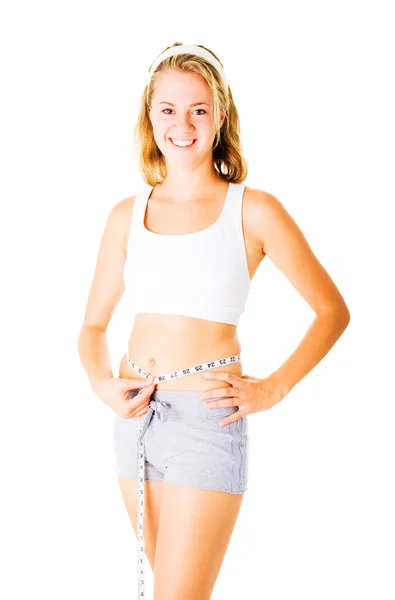 Jeune femme se mesurant sur blanc — Photo