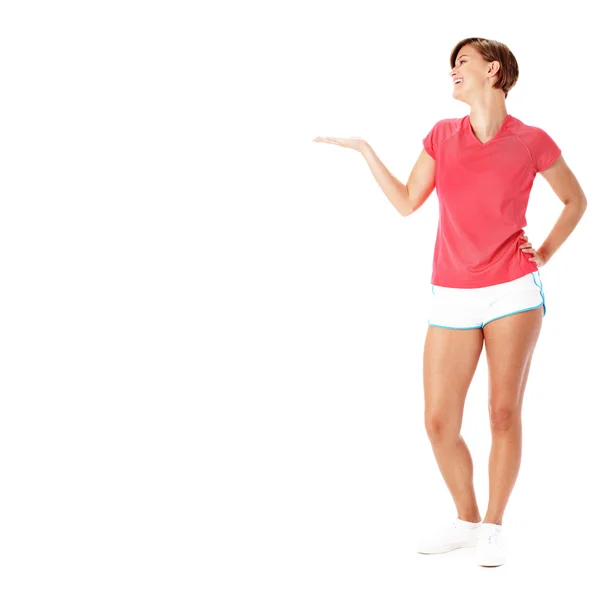 Unga fitness kvinna i röd tröja presentera, iso — Stockfoto