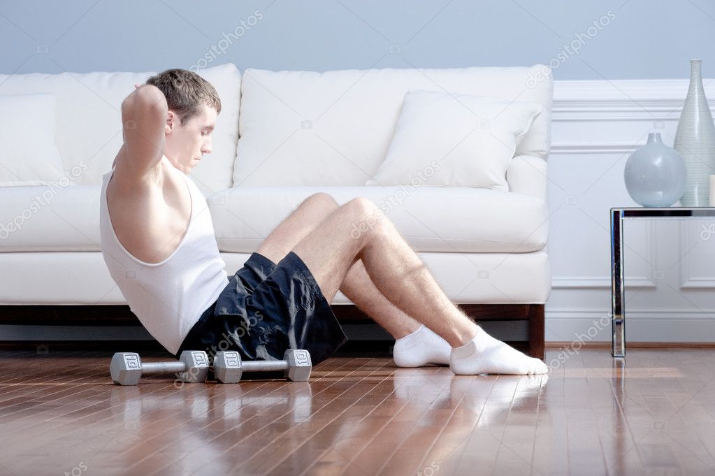 Man Doing Sit-ups in Living Room