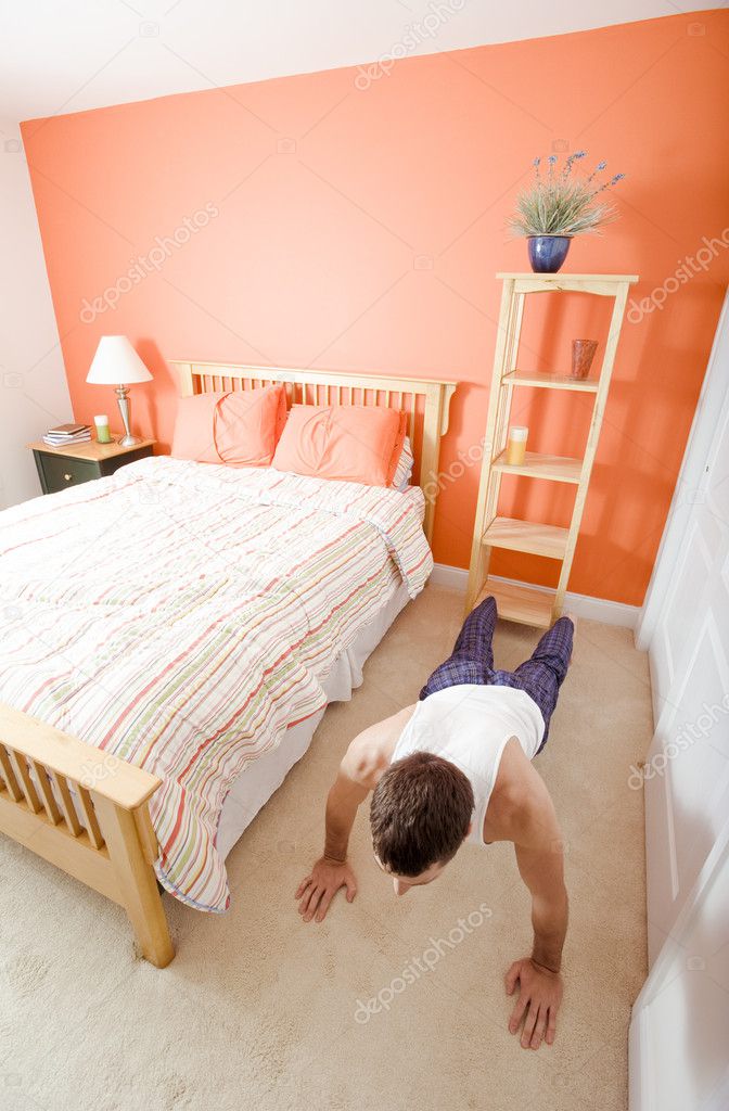 Man Doing Push-Ups in Bedroom