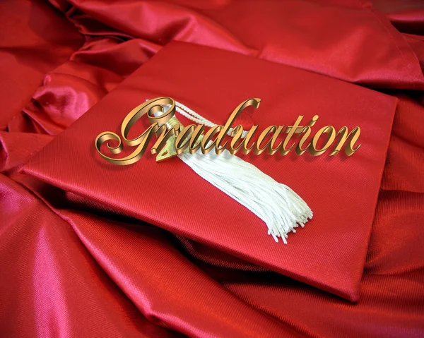 Graduation red cap and gown — Stock Photo, Image