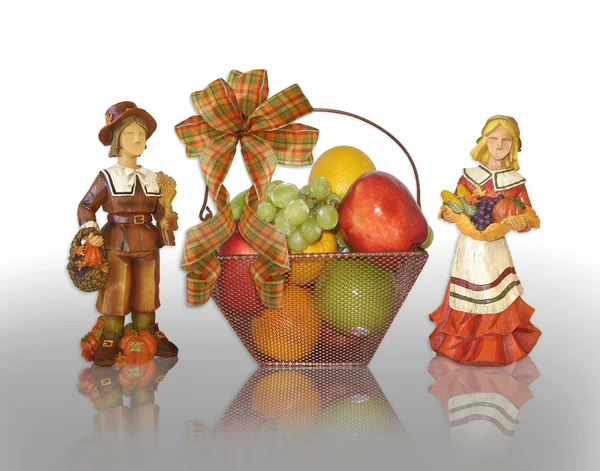 Thanksgiving pilgrims and fruit basket — Stock Photo, Image