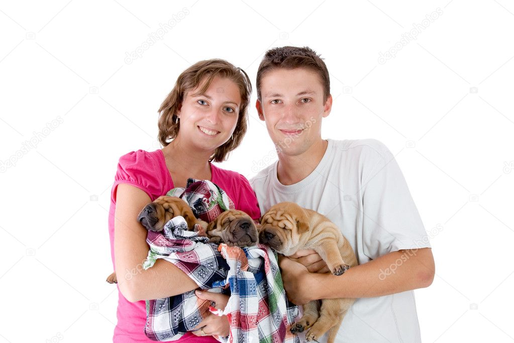 Couple with three Shar Pei baby dogs