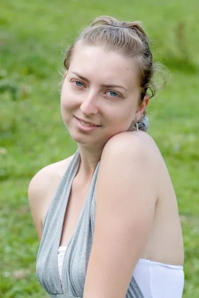 Beautiful girl in a meadow — Stock Photo, Image