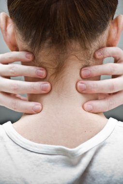 Woman has pain in a neck clipart