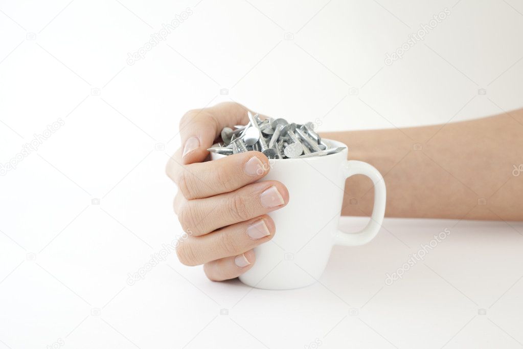Woman cradles a Cup of Nails Coffee Cup