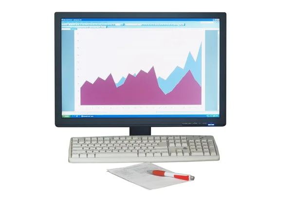 Комп'ютер, діаграма, папір і ручка — стокове фото