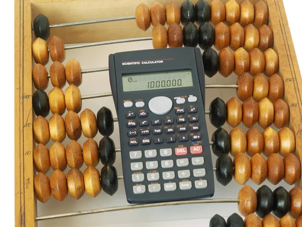 Abacus and the calculator — Stock Photo, Image