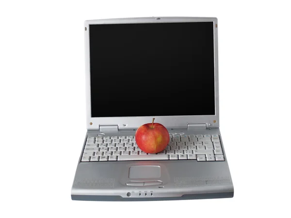 Den bärbara datorn och ett äpple — Stockfoto