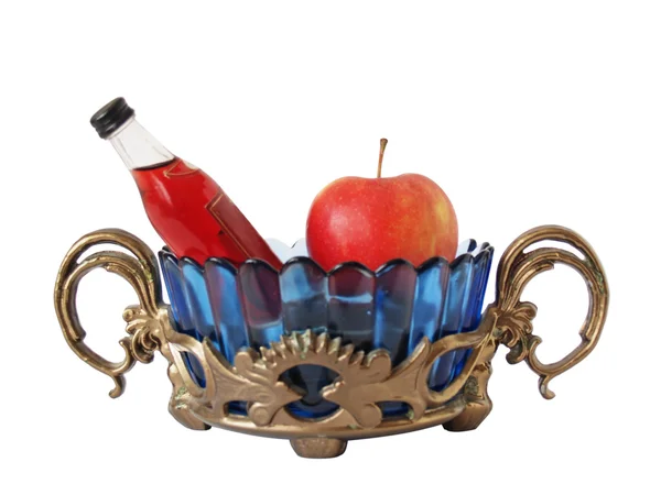 Soporte, jarrón, botella y una manzana — Foto de Stock