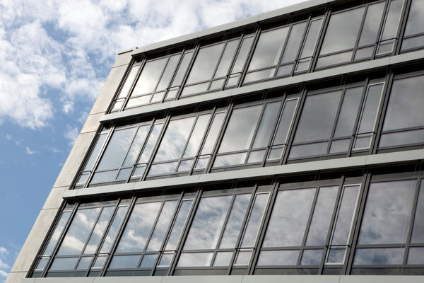Business building with glas windows and reflections