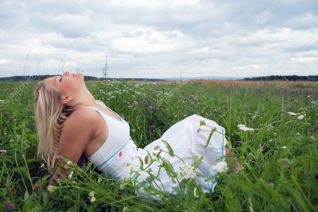 Young woman on a meadow