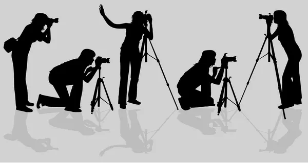 Photographers shooting model — Stock Vector