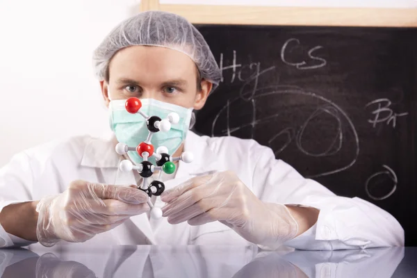 Scientist, molecule and table — Stock Photo, Image
