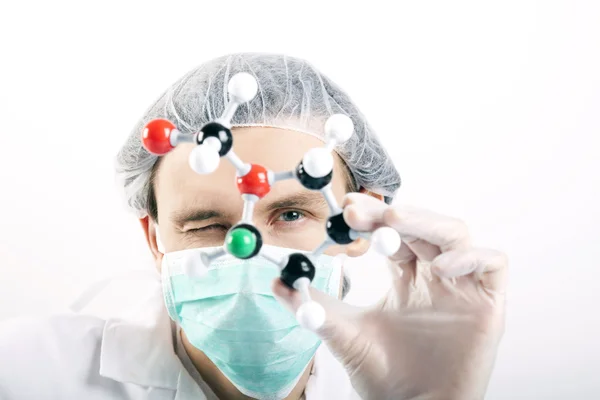 Scientist with atoms — Stock Photo, Image
