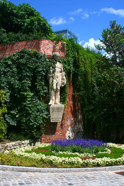 Sculpture in flower garden, Graz — Stock Photo, Image