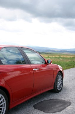 Alfa Romeo on the road in Slovakia clipart