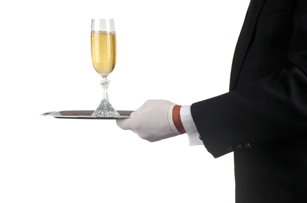 Человек в смокинге, подающий шампанское — стоковое фото