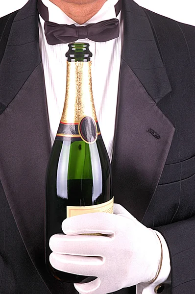 Man in smoking met champagne fles — Stockfoto