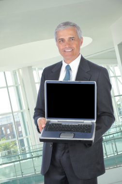 Businessman with Laptop Computer clipart