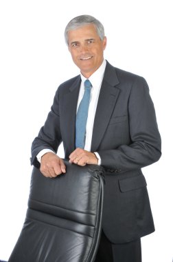 Businessman Standing Behind His Chair clipart