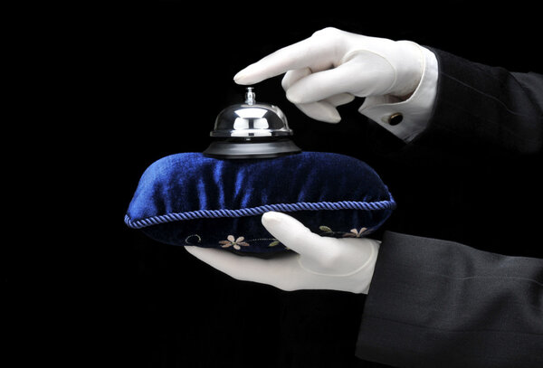 Bulter Ringing Bell on Pillow