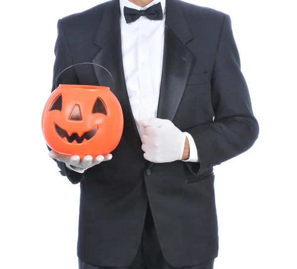 Butler Holding Plastic Pumpkin — Stock Photo, Image