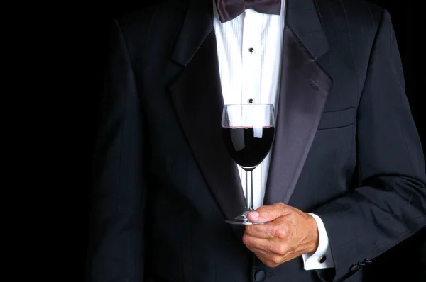 Homem segurando um copo de vinho — Fotografia de Stock