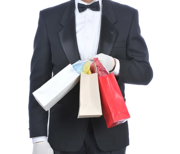 Man in Tuxedo with Gift Bags — Stock Photo, Image