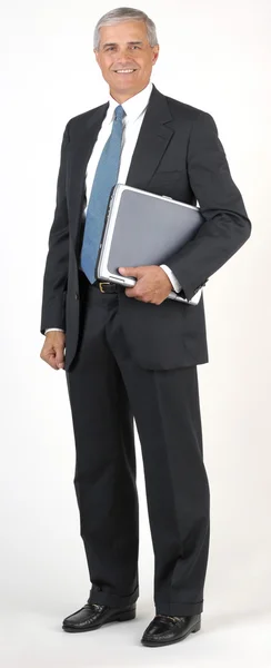 Uomo d'affari pieno lunghezza hodling computer portatile — Foto Stock