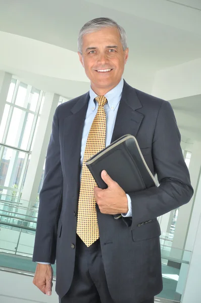 Businessman with Notebook Stock Picture