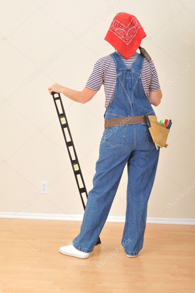 Woman in Overalls and Toolbelt