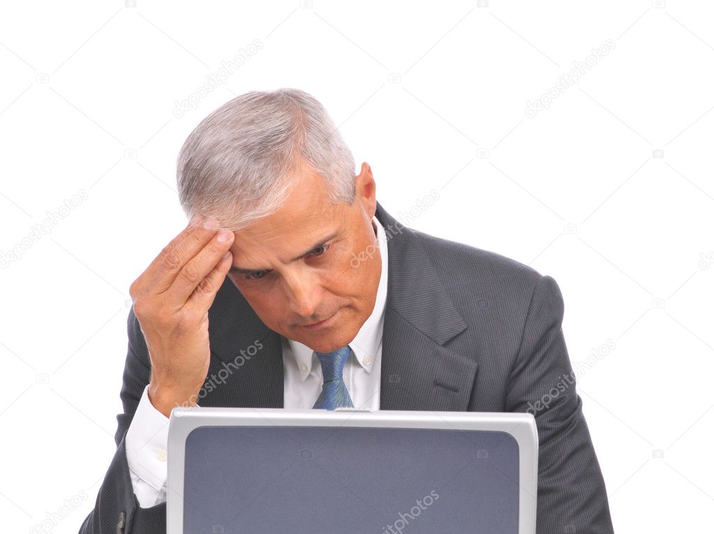 Businessman seated at laptop