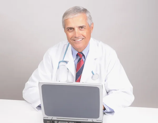 Smiling Mature Doctor in Lab Coat — Stock Photo, Image