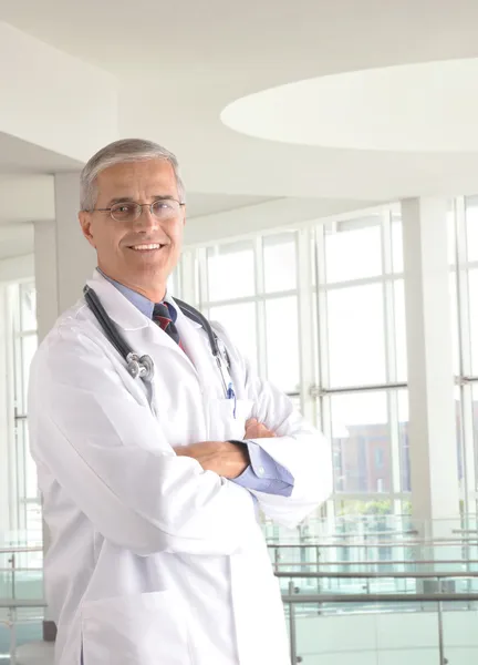 Middle aged doctor in medical facility — Stock Photo, Image