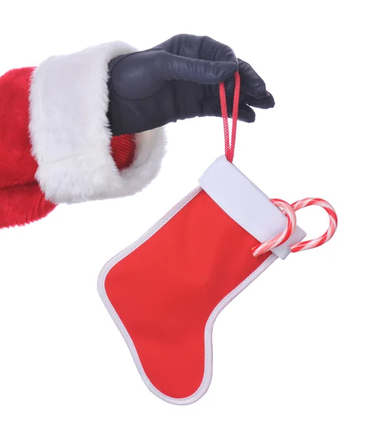Santa asılı şekerler ile çorap — Stok fotoğraf
