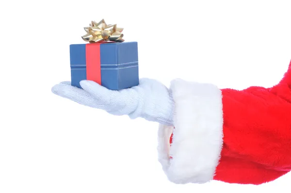 Santa claus hand met preent — Stockfoto