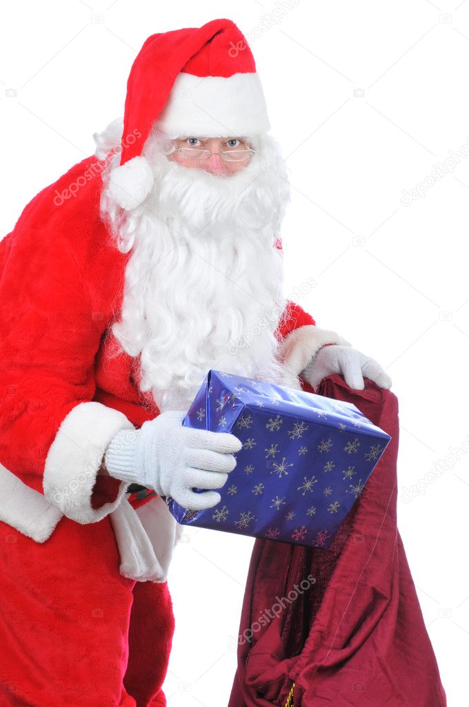 Santa Claus Putting Present in Bag