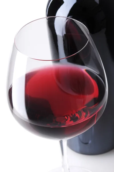 Close up de garrafa de vinho e vidro — Fotografia de Stock