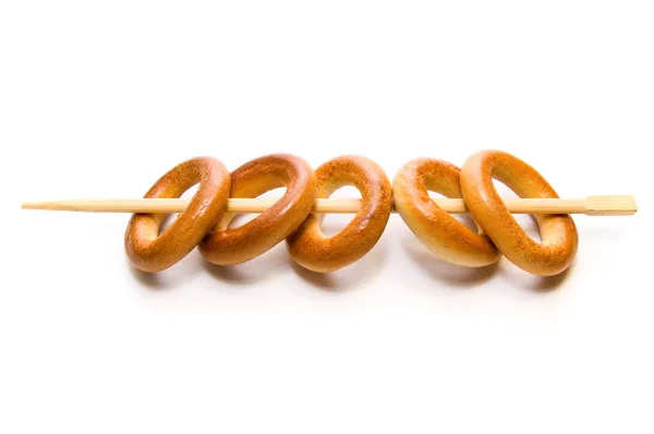 Bread rings on chopstick — Stock Photo, Image