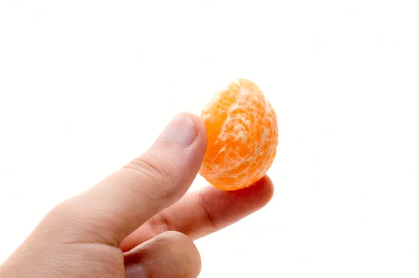 Hand with mandarin segment — Stock Photo, Image