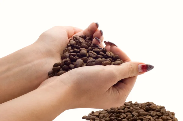 Female hands and coffee beans — Stock Photo, Image