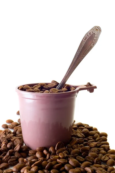 Cup met lepel en koffie bonen — Stockfoto