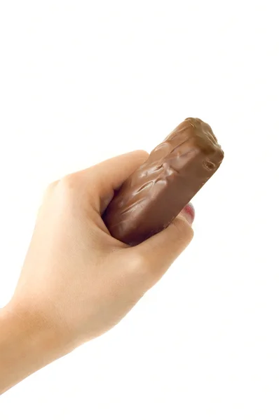 Ręka trzymać pasek czekolady — Zdjęcie stockowe