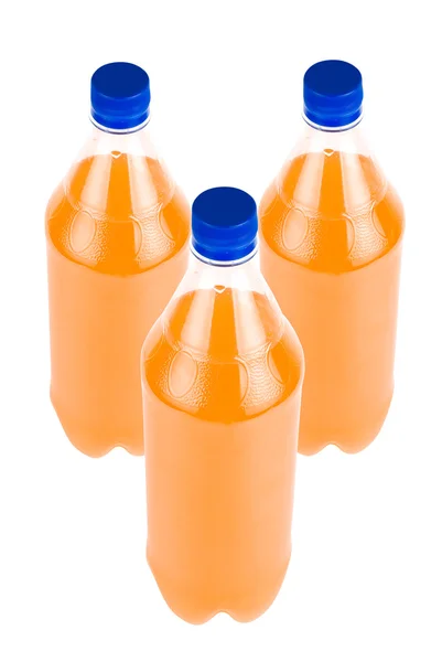Tři pomerančový džus láhev — Stock fotografie