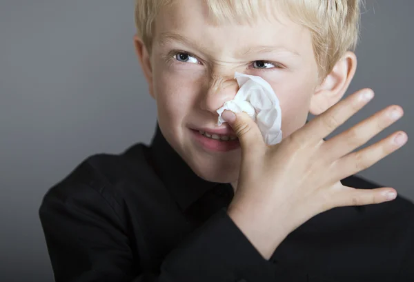 stock image Young blonde boy with a cold
