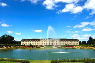 Fountain and pond in front of royal pala clipart