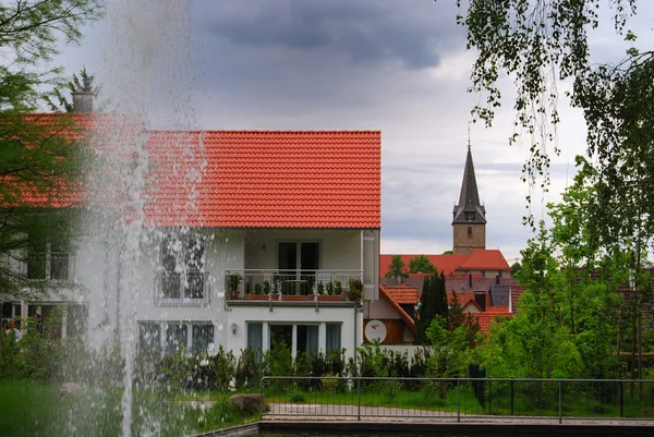 Fountain and small German town — Stock Photo, Image